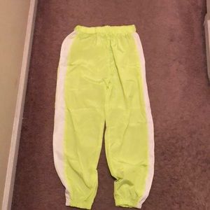 Green reflective track pant joggers.